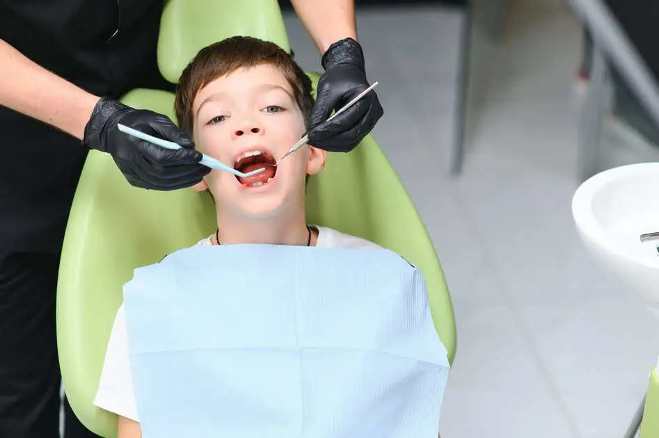 Nurse filling the teeth of boy with Dental Fillings in Summerville, Sc
