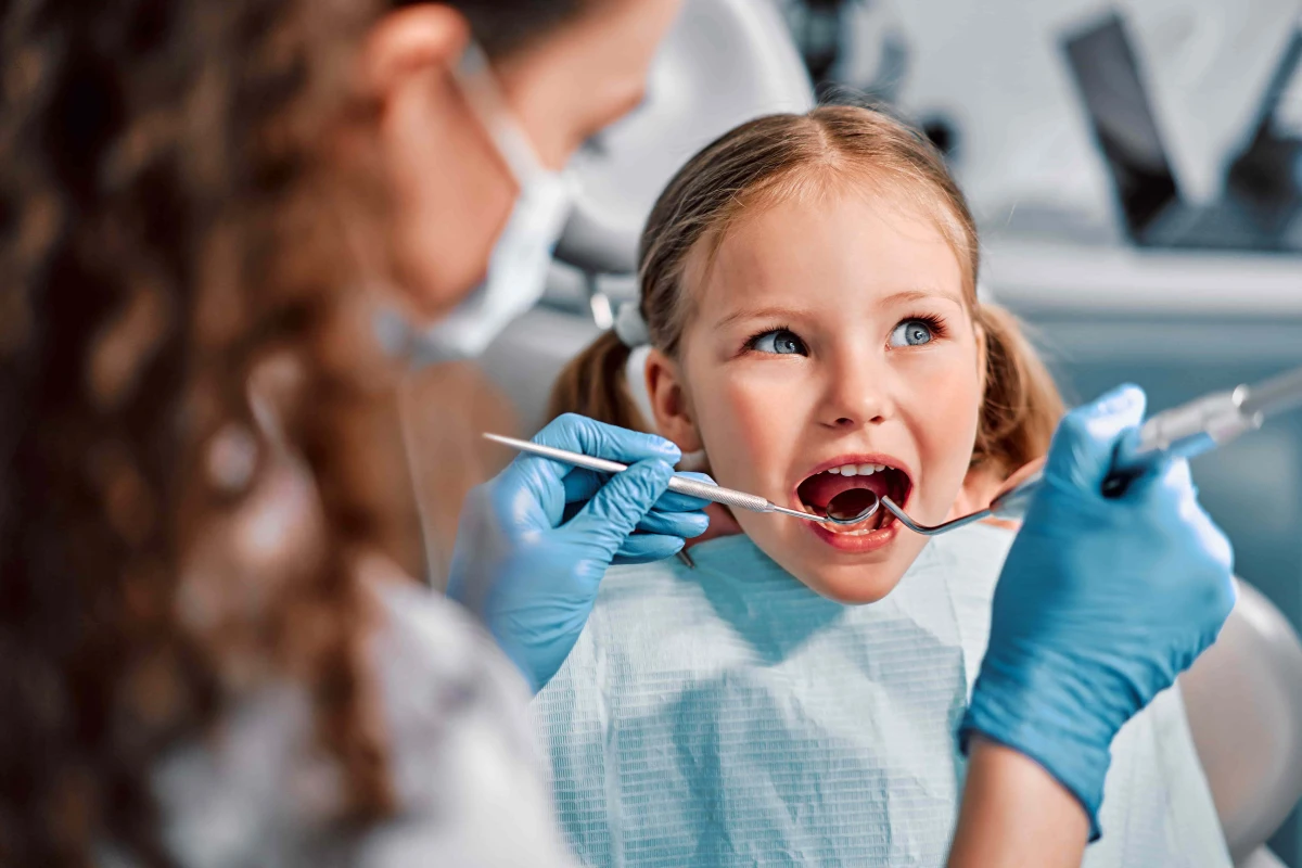 Child receiving preventive cavity fillings in Summerville, SC, during a comfortable pediatric dental visit to treat tooth decay and protect long-term oral health.